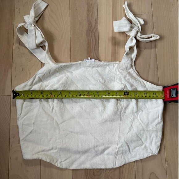 Minimalist off-white corset-style top with tie straps - Picture 3 of 7